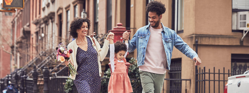 Family walking with anniversary flowers