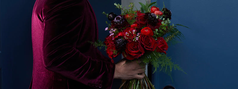 Man bringing Valentine's day flowers to the door